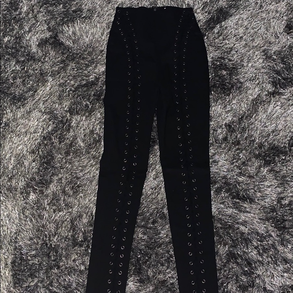 Stretchy black leggings with  lace up detail